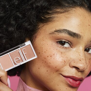 Model Holding Eyeshadow Palette