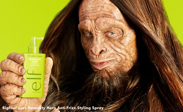 Bigfoot holding e.l.f. Humidity Hero Anti-Frizz Styling Spray