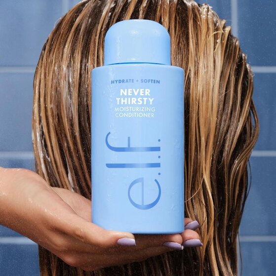 Model Using e.l.f.'s Never Thirsty Moisturizing Conditioner