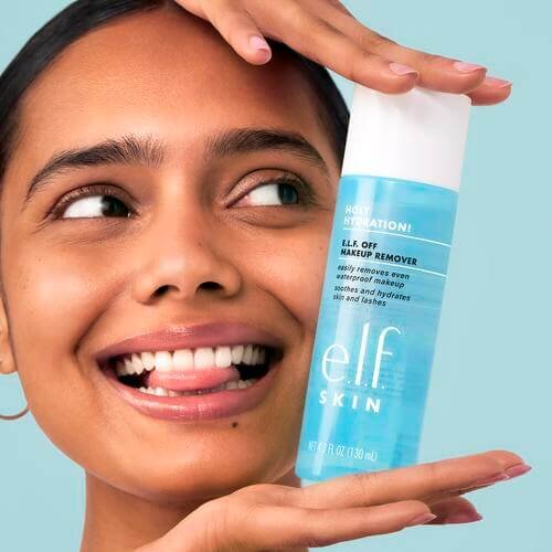 Woman holding e.l.f. Off Makeup Remover