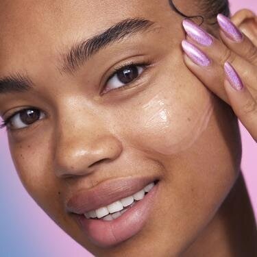Model Applying Niacinamide to Face