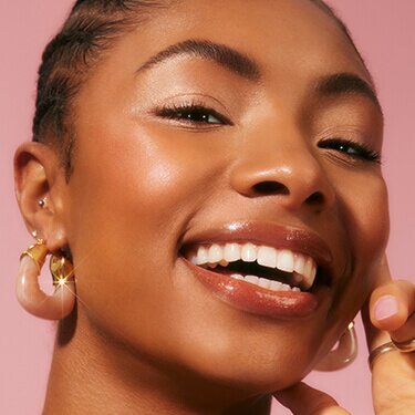 Smiling woman with fresh makeup look