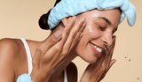 Model Applying Skin Tint