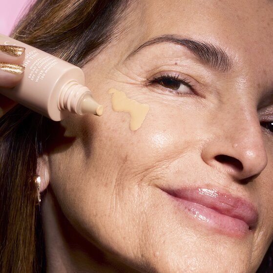 Woman Applying Skin Tint