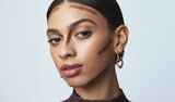 Model Applying Skin Tint