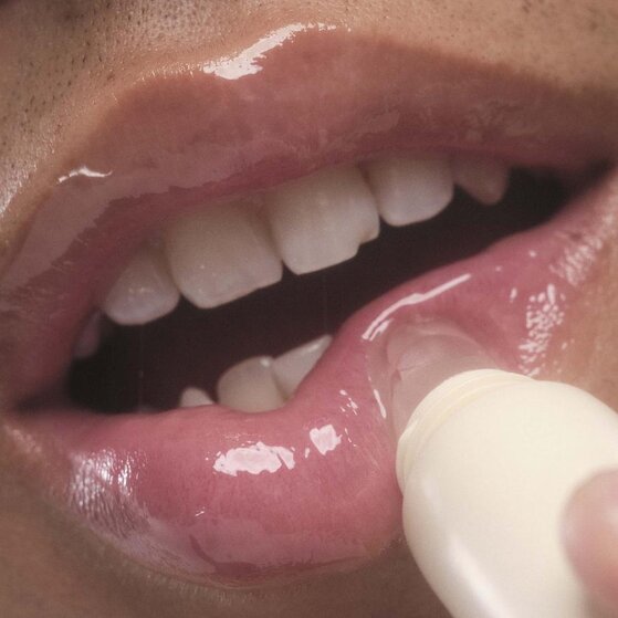 Applying Vanilla Flavored Lip Balm