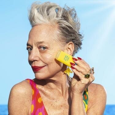 Woman Applying Invisible Sunscreen