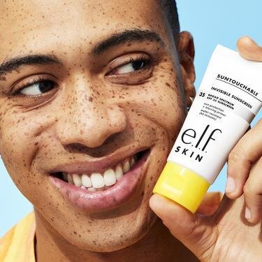 Model Holding Invisible Sunscreen 35