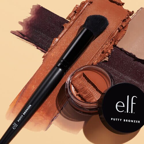 Putty Bronzer in a deep tone with bronzing brush