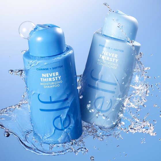 e.l.f. Never Thirsty Moisturizing Shampoo and Conditioner bottles surrounded by water splashes