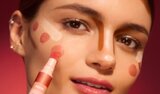 Model showing face mapping of where to apply liquid blush and highlight