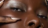 Model Applying Skin Tint
