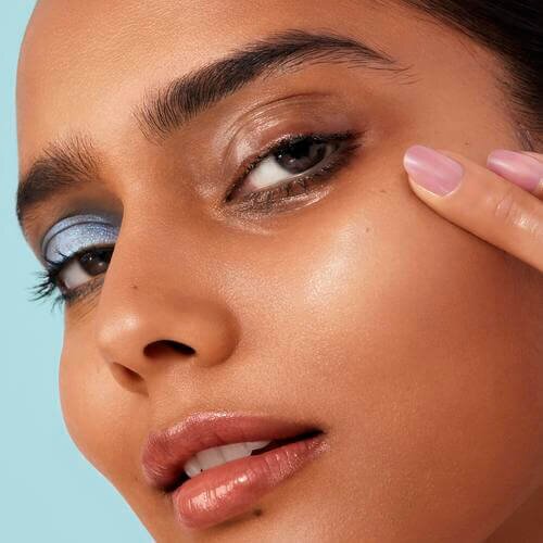 Woman with one eye that has makeup removed
