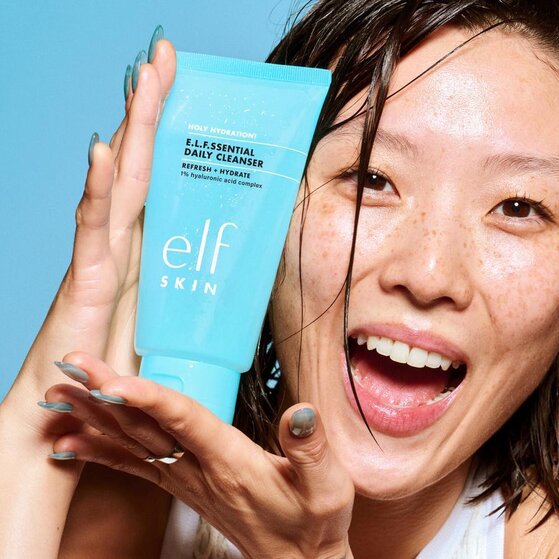 Model Holding Holy Hydration! Daily Cleanser