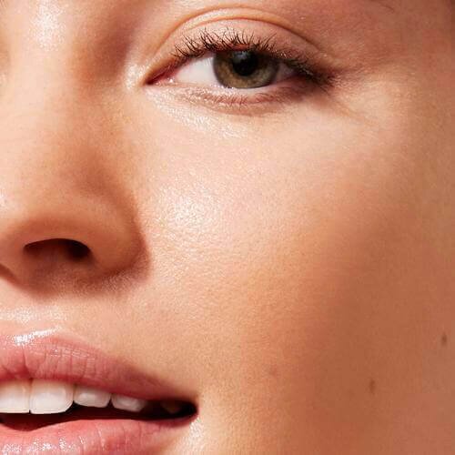 Close-up of a woman's cheek with makeup