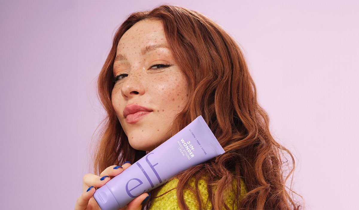Model with Wavy Hair Holding Hair Styling Cream
