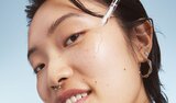 Model Applying Skin Tint