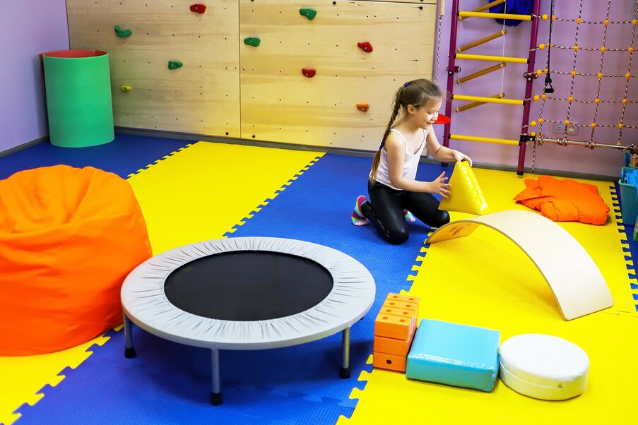 A 5-year-old girl playing in Fun and Function's sensory rooms
