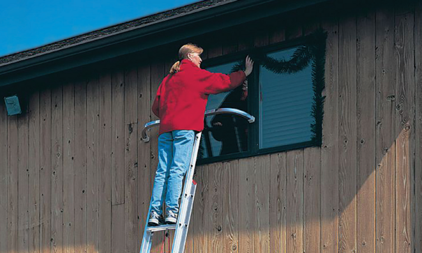 women repairing window