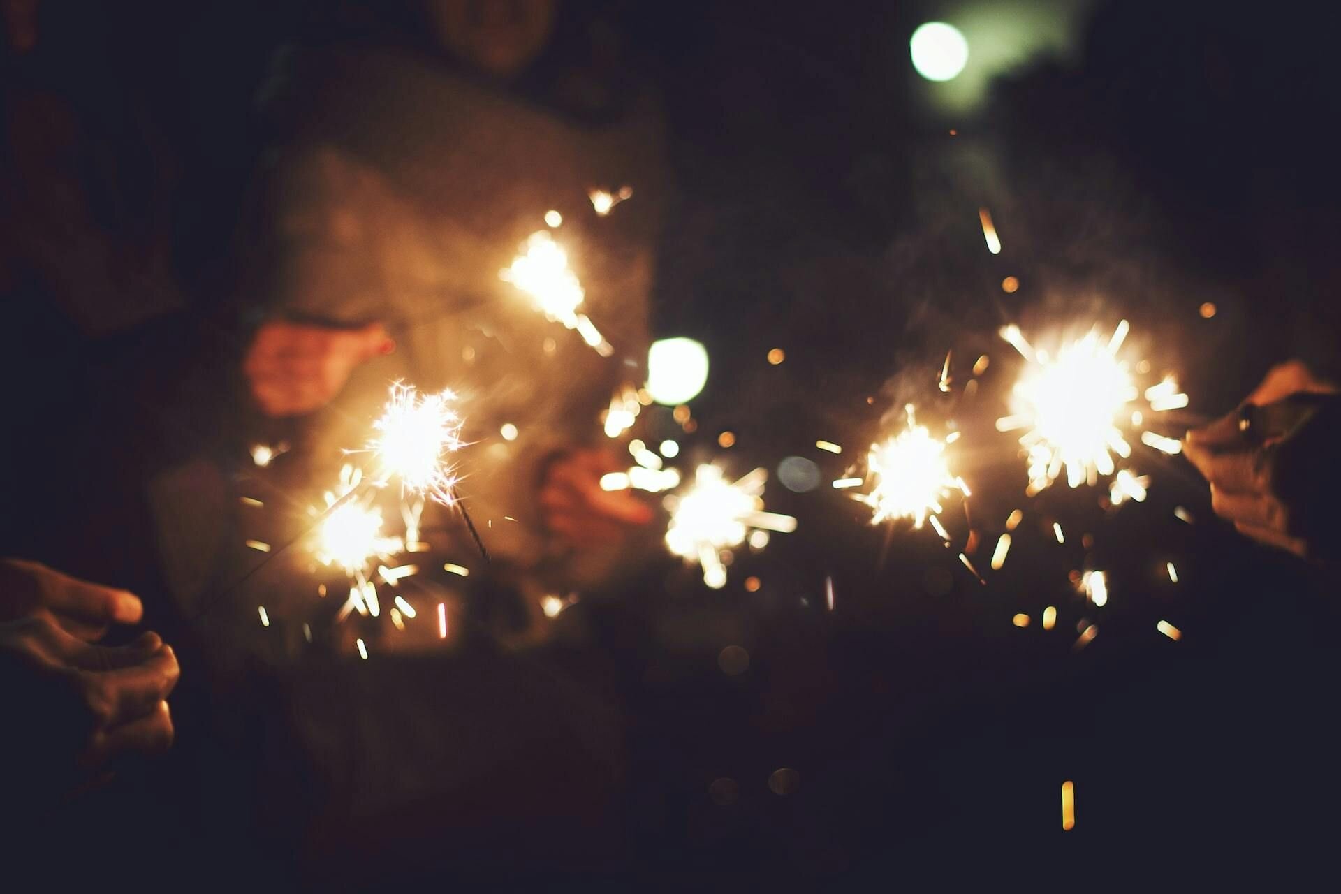 People holding sparklers