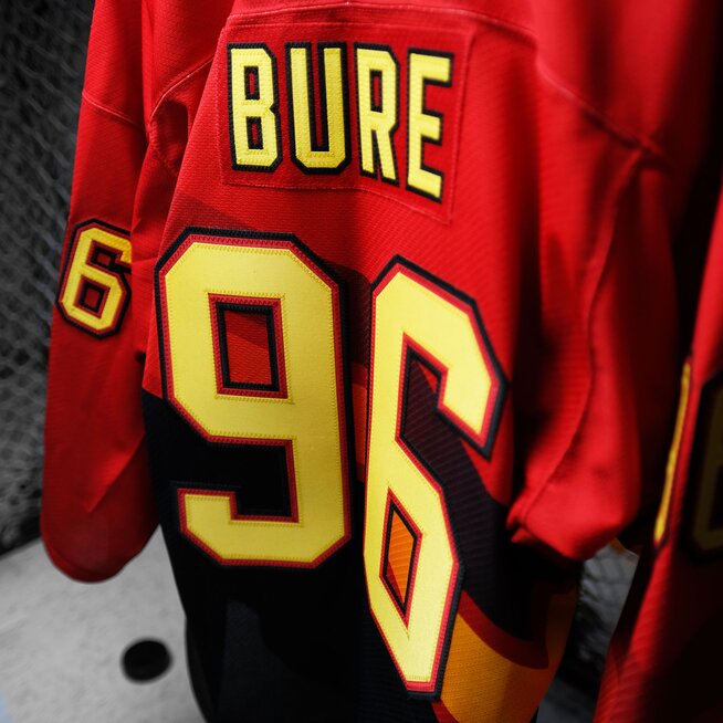 Close up of NHL Lettering Kit applied to a red hockey team jersey