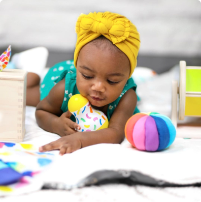 User photo of baby playing with Rainbow Spinner