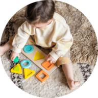 Child playing with Lovevery toys