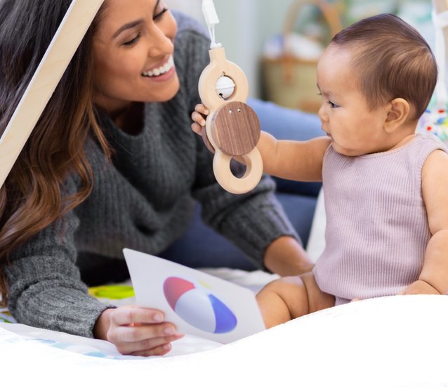 Mother and baby playing with the Play Gym