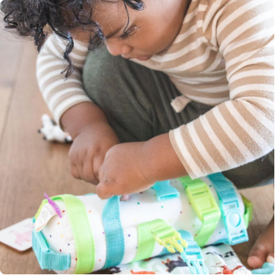 User photo of baby playing with the Flexible Wooden Stacker