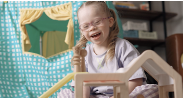 Alt text placeholder: girl playing with modular playhouse