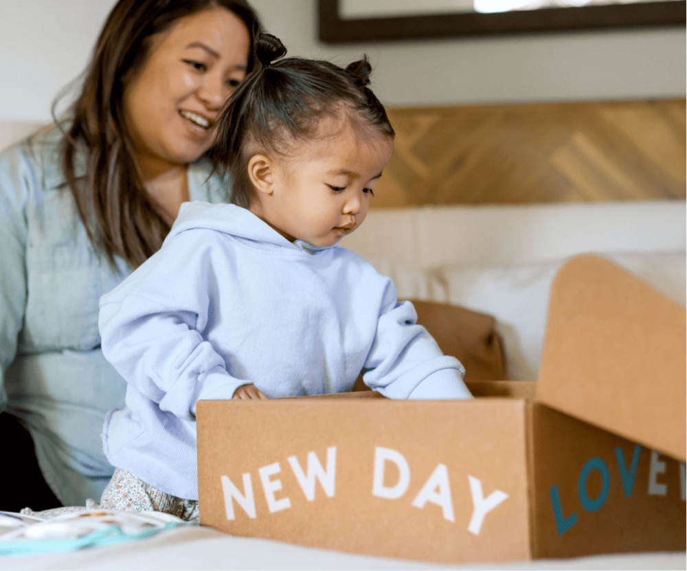 Mother and daughter opening a Lovevery Box