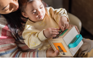 Mother and child playing with Lovevery Plaything