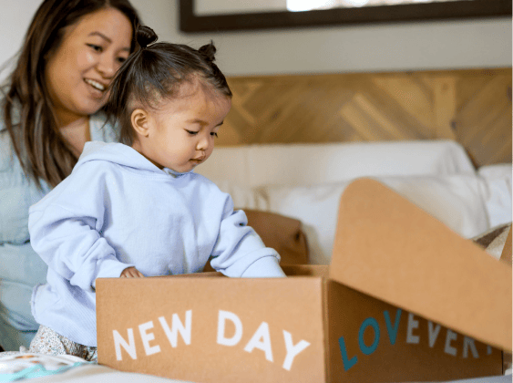 Mother and daughter opening a Lovevery Box