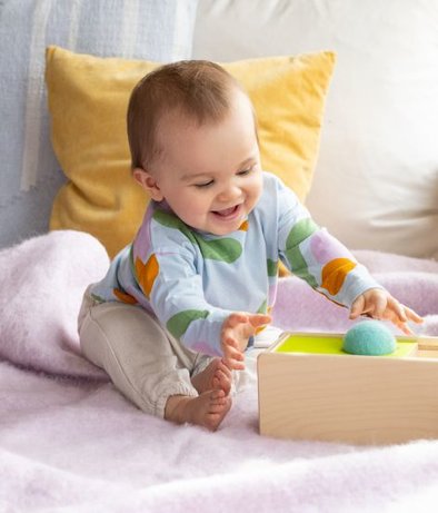 Baby playing with Lovevery Drop Box