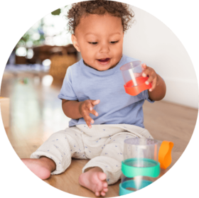 Baby playing with the Nesting Stacking Dripdrop Cups