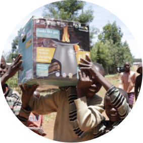 Children holding a BioLite Stove in Uganda