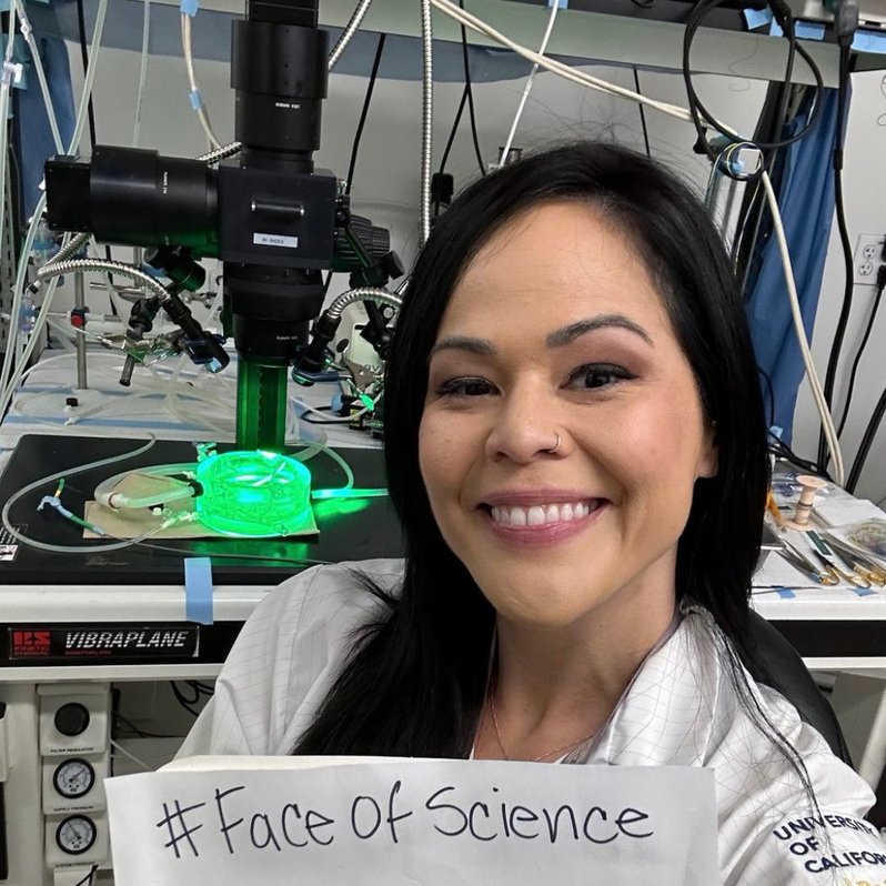 Amanda Guevara holding a #FaceOfScience sign