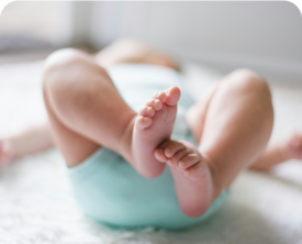 Baby laying on a changing table