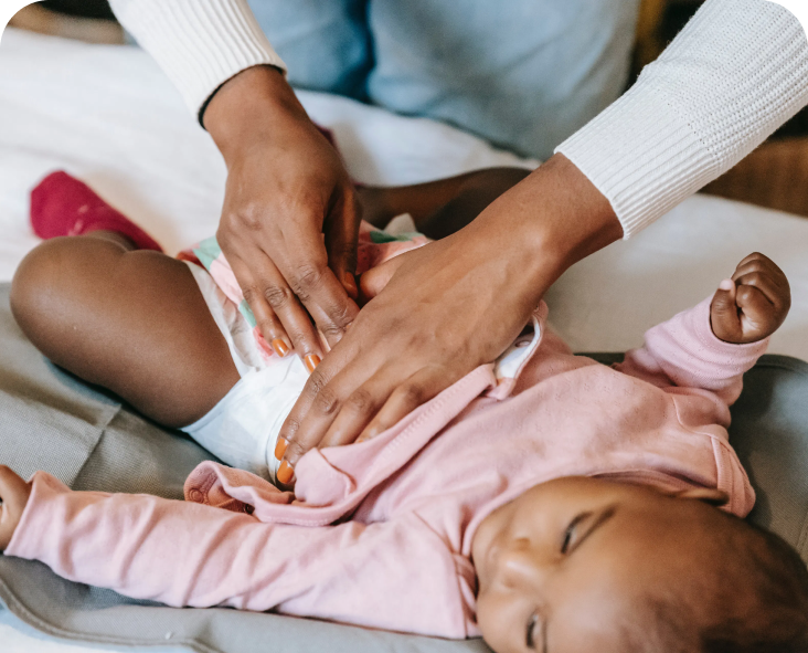 Mom changing a baby's diaper