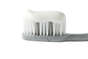 Grey toothbrush with white toothpaste