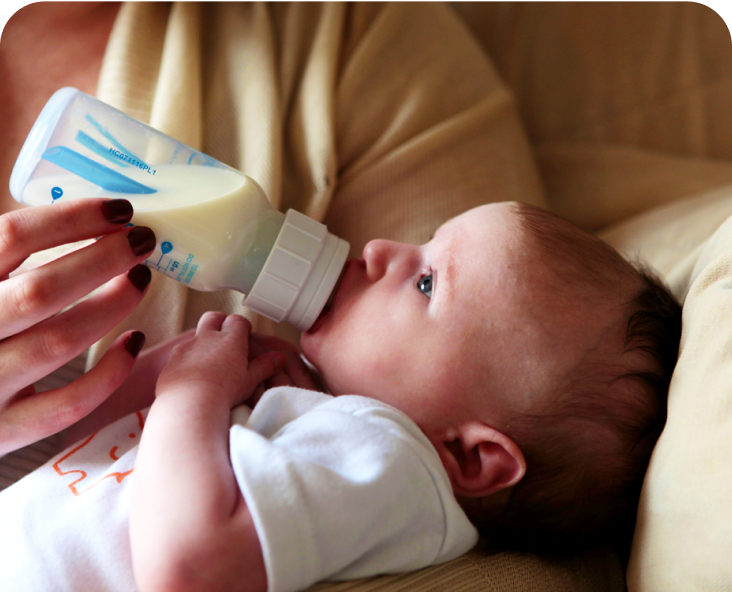 Baby drinking out of a bottle