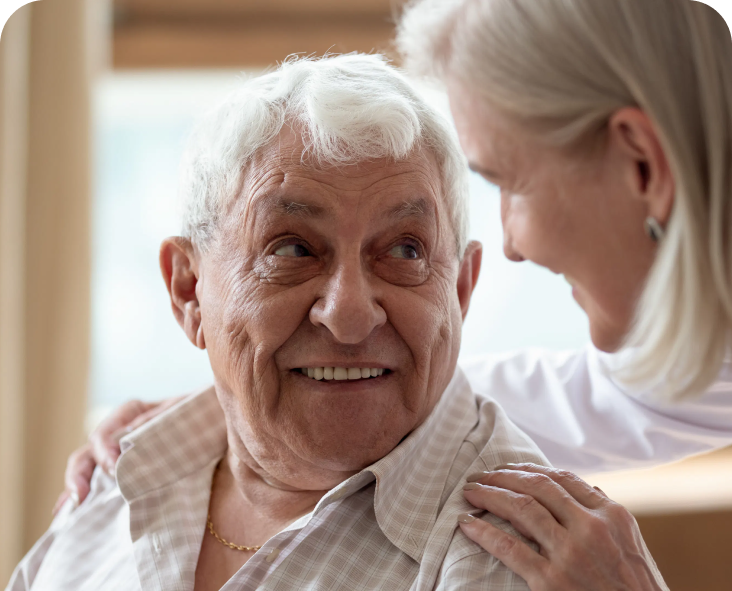 Image of a woman looking at elderly man