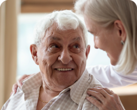 Image of a woman looking at elderly man