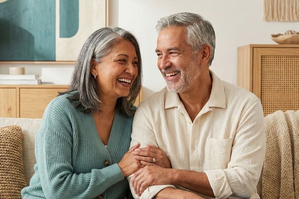 Happy senior couple relaxing in their living room