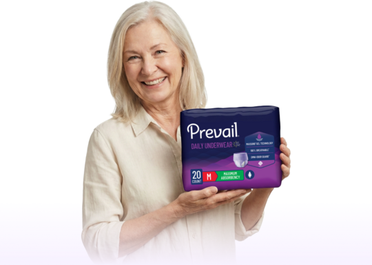 Woman holding Prevail underwear package