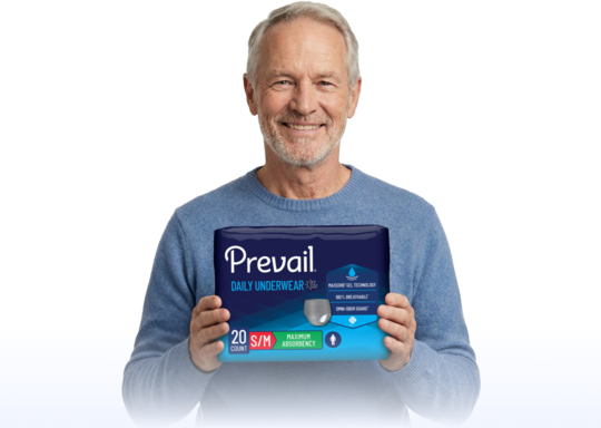 Man holding Prevail underwear package