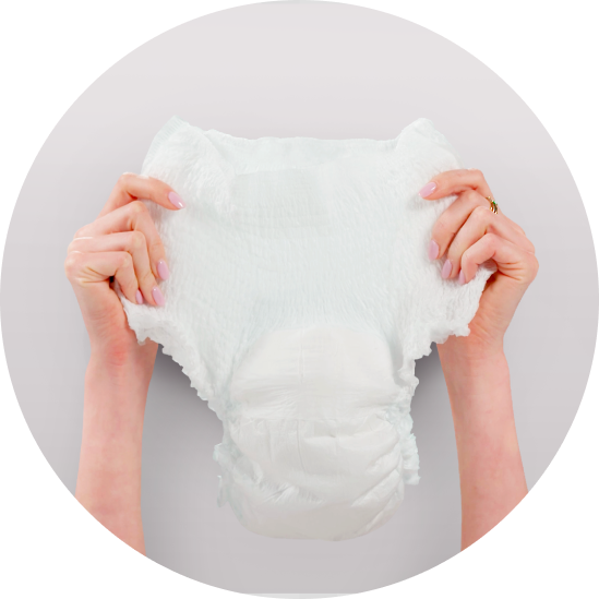 Image of hands holding up an adult diaper.