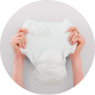 Image of hands holding up an adult diaper.