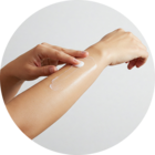 Image of a hand holding a tube of Calmoseptine.