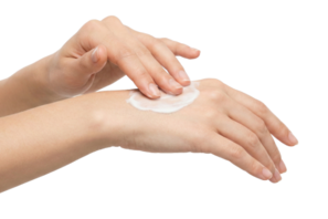 Hands applying lotion